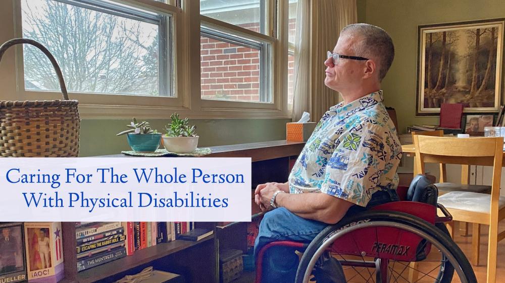 Middle-aged man in wheelchair looking outside through window.